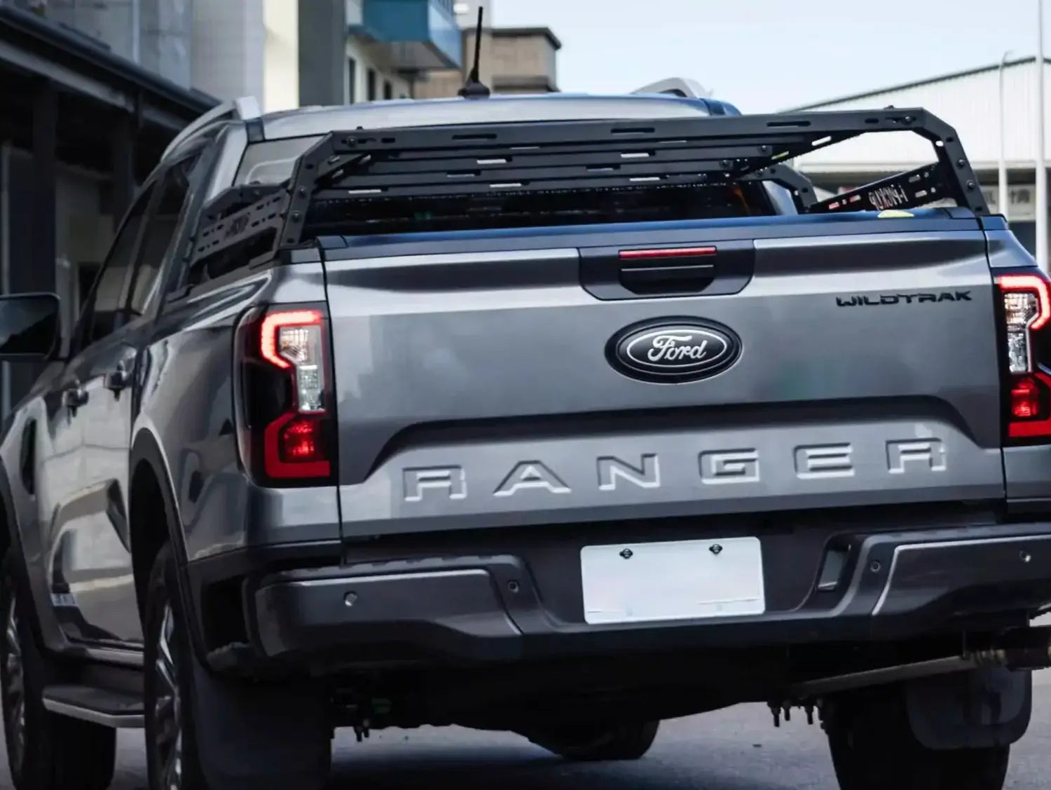 Grey Ford Ranger equipped with a tub rack utility multifunction carrier cage for secure gear transport