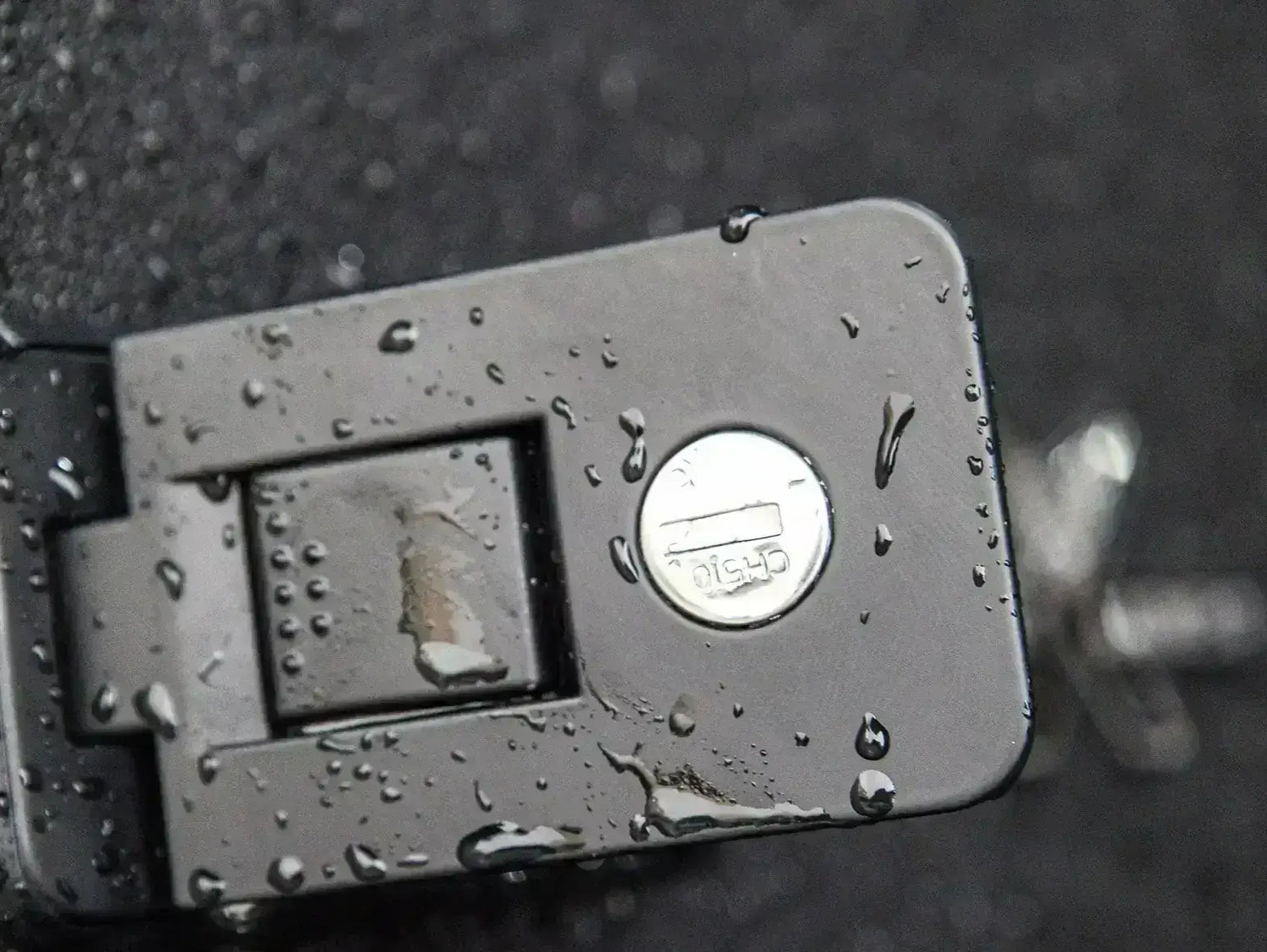 Close-up of lock mechanism on KGM Musso Canopy for SsangYong Musso XLV 2018-2025 showcasing durability in wet conditions.