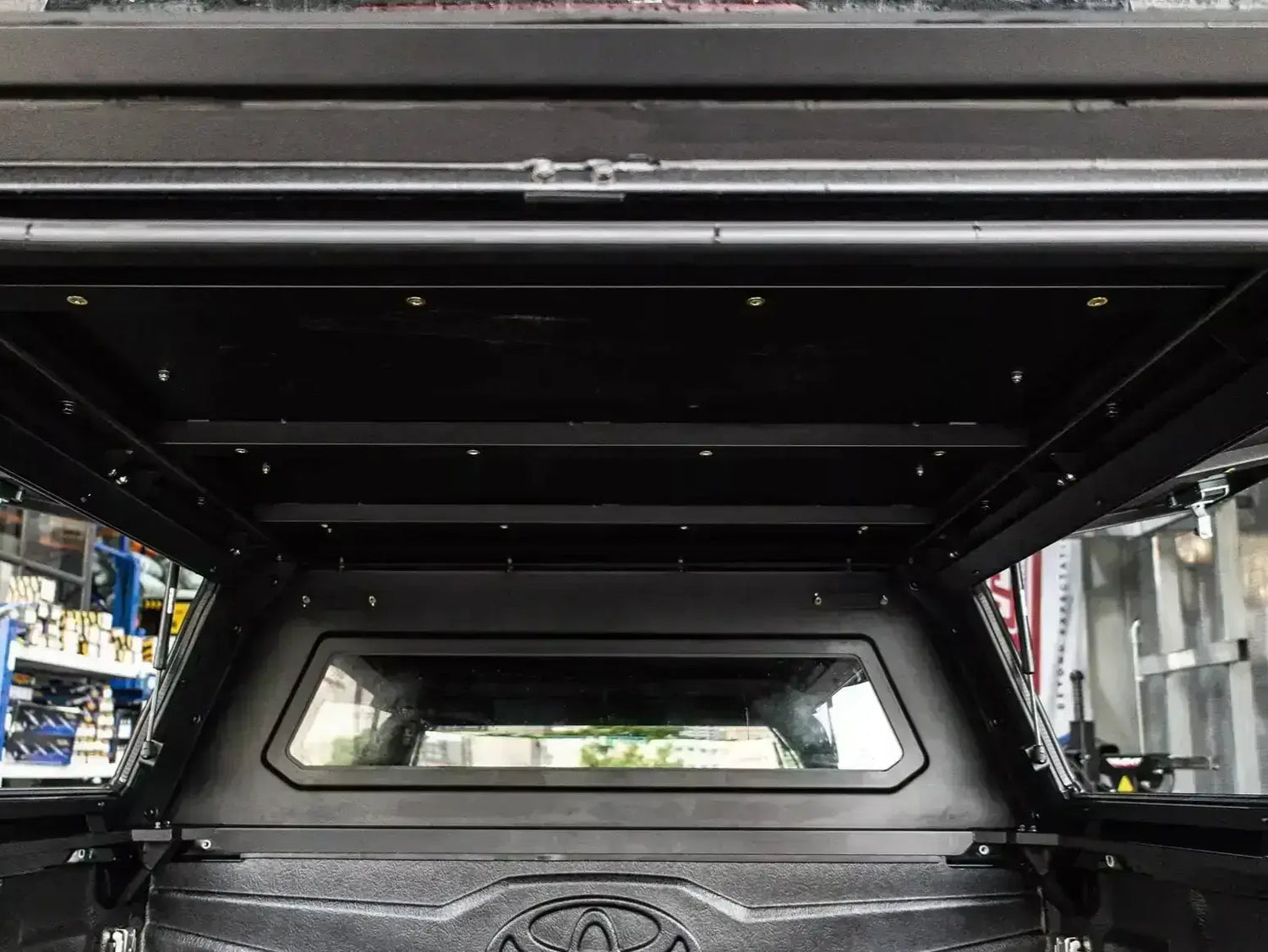 Interior view of Canopy Triton for Mitsubishi MV 2024+, featuring durable stainless steel construction for reliability and strength.