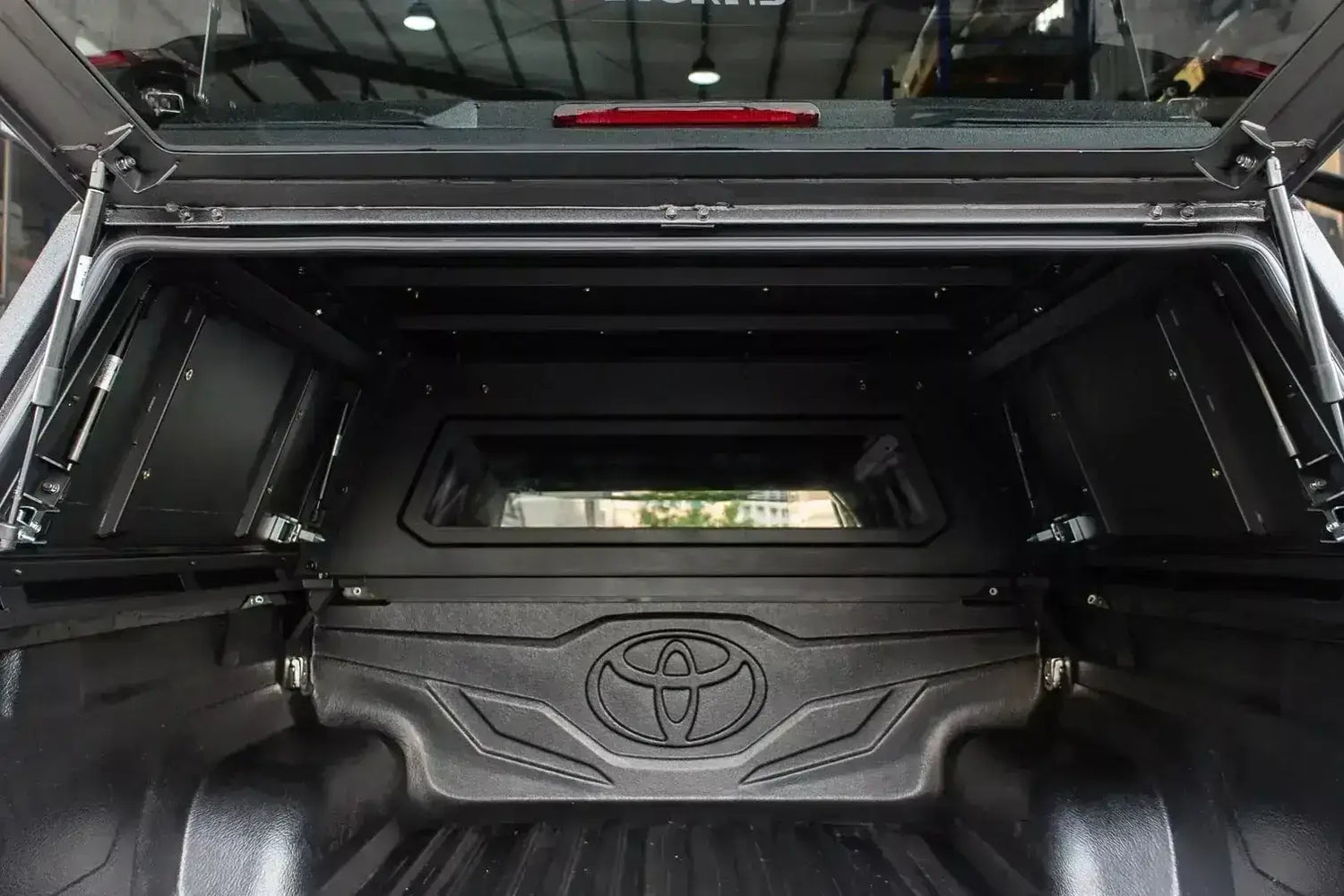 Interior view of canopy triton on Mitsubishi Triton MV 2024+ displaying durable stainless steel construction.