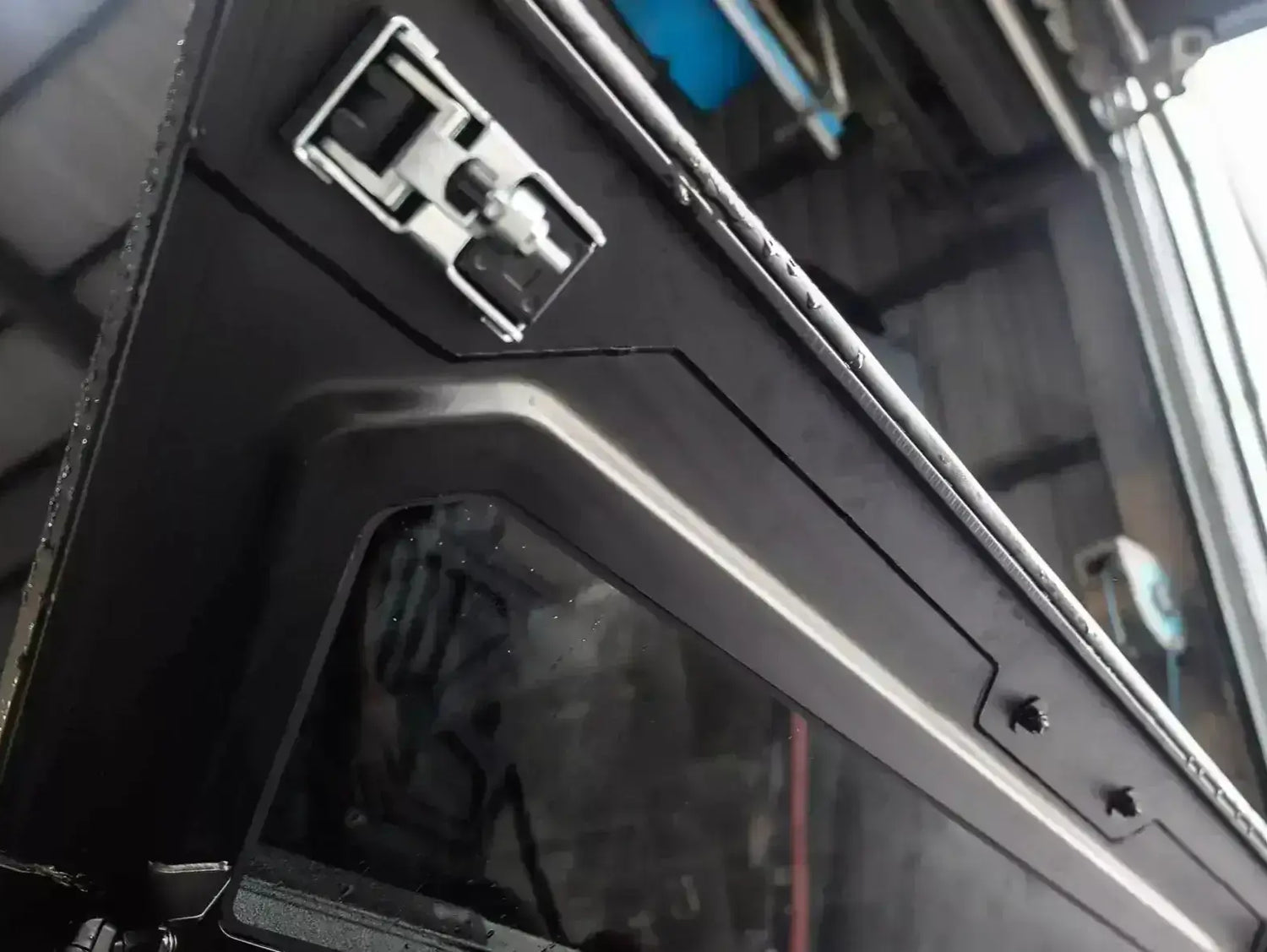 Close-up of KGM Musso Canopy for SsangYong Musso XLV 2018-2025, showing stainless steel lock detail.