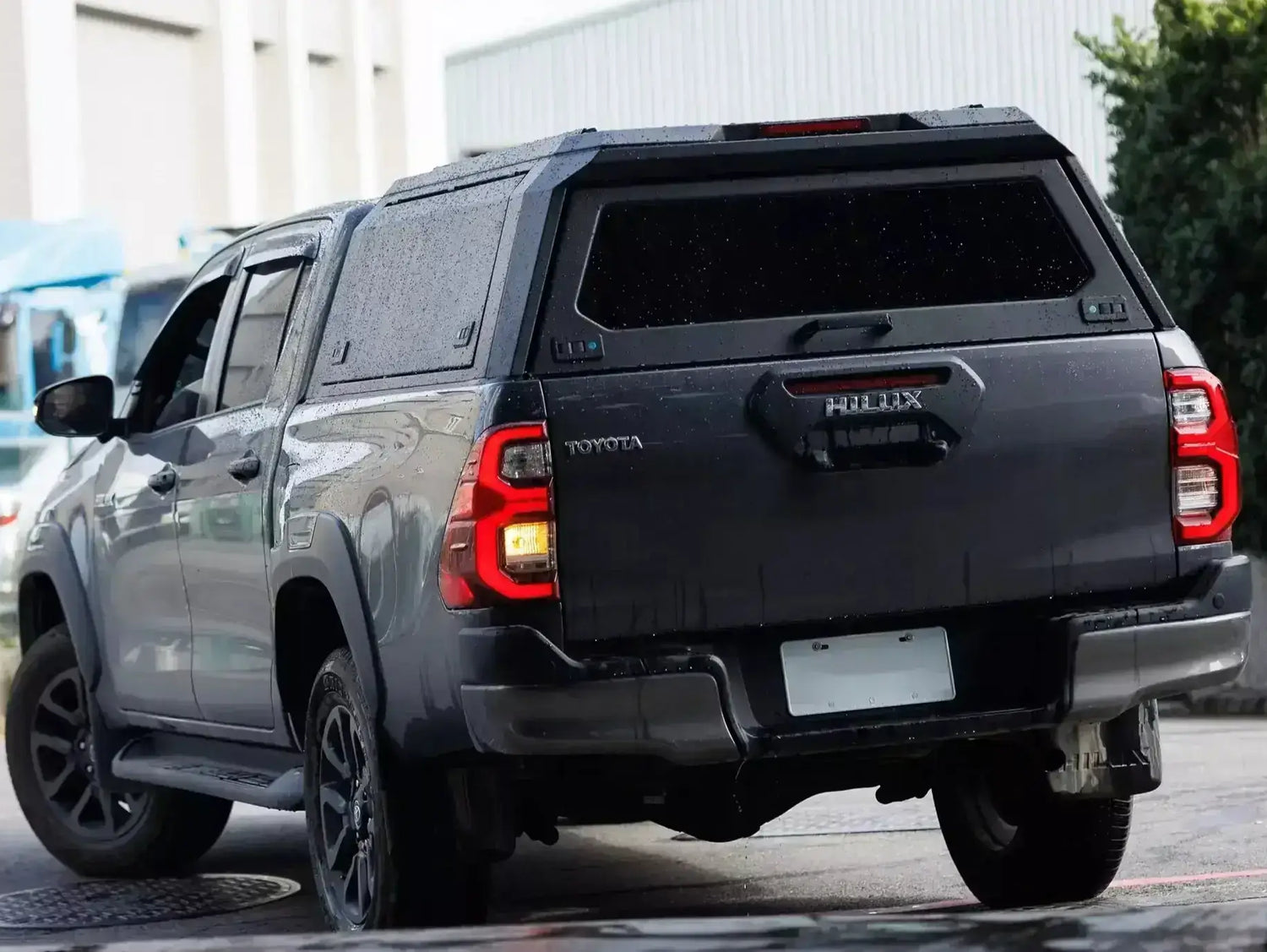 Black ute with stainless steel canopy triton MV 2024+ parked outdoors