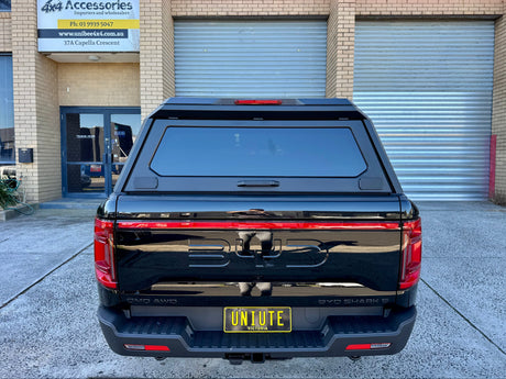 UniUte stainless steel canopy on BYD Shark 6 — rear three-quarter view closed