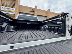 Toyota Hilux N80 N90 electric roller shutter — detail of the canister and mounting rails