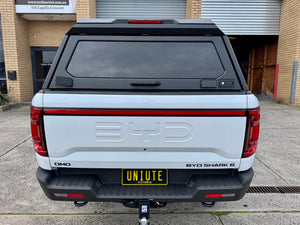BYD Shark 6 stainless steel canopy — rear hatch open with the tailgate down