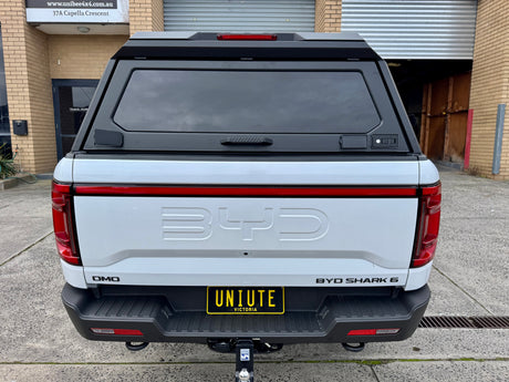 BYD Shark 6 stainless steel canopy — rear hatch open with the tailgate down