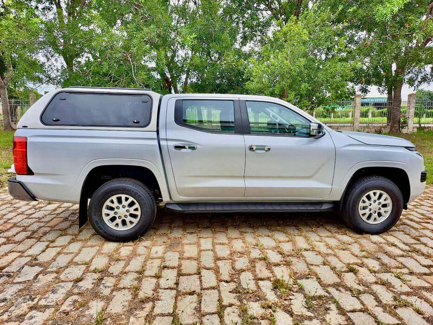 Side view of Mitsubishi MV 2024 with Triton Canopy FORCE PRO series, showcasing rugged design for work and adventure.