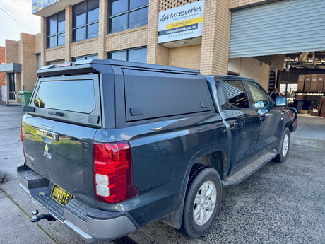 Mitsubishi Triton MV 2024+ stainless steel canopy — front three-quarter view showing roofline