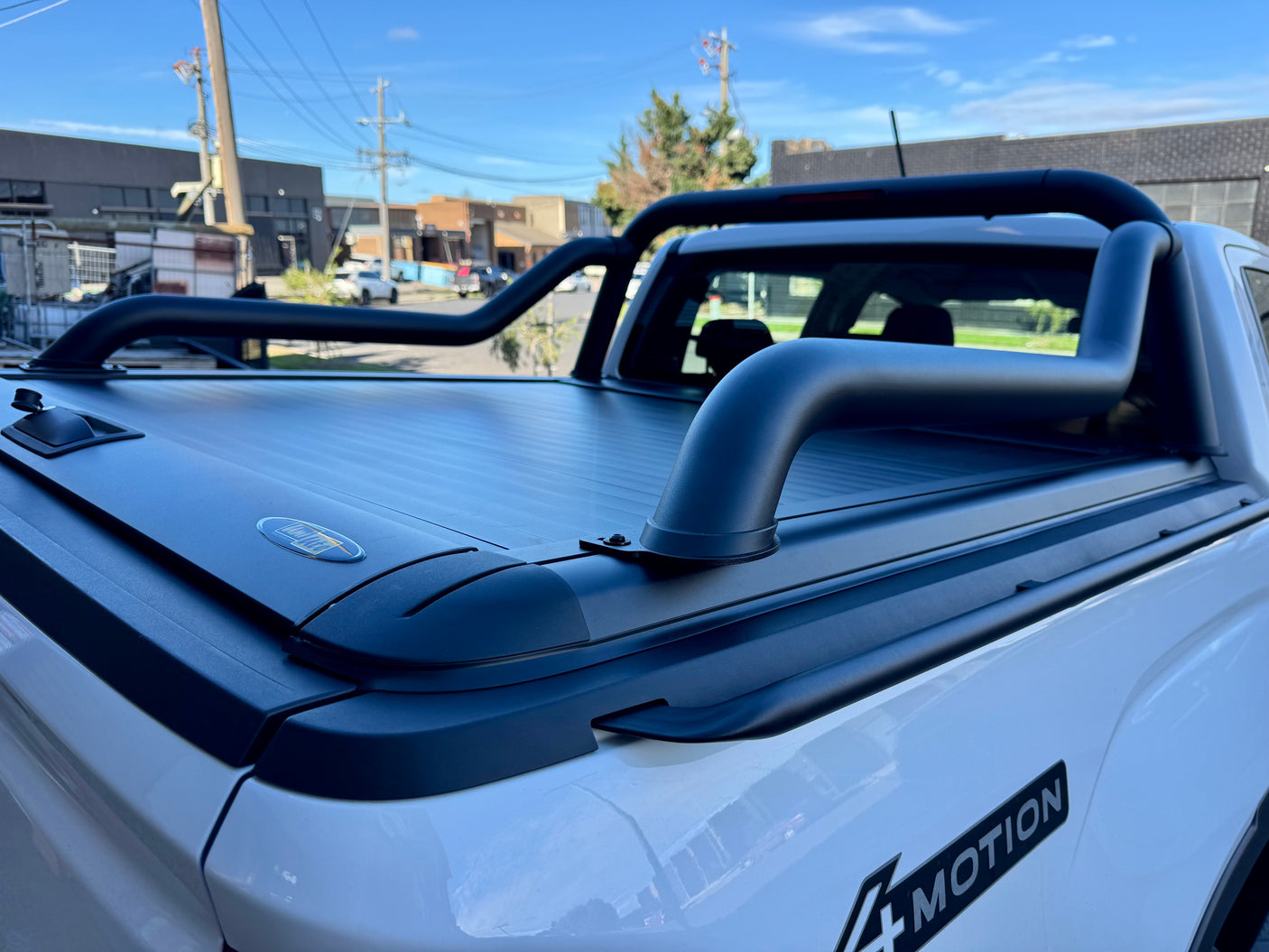 Extended sports bar for UniUte Gen2/EGen2 roller shutters — matte black bar fitted on ute | UniUte