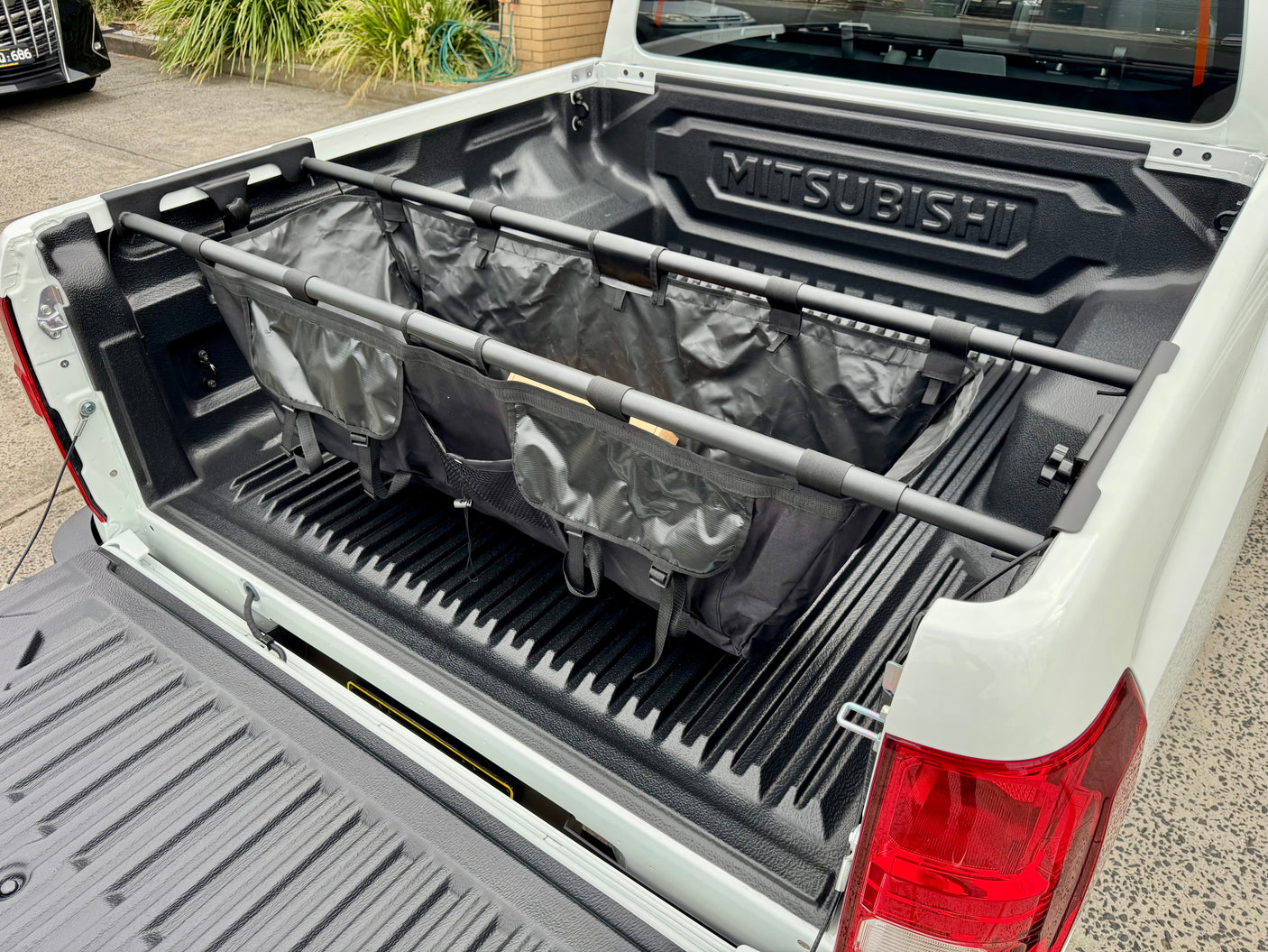 UniUte tub hammock — installed in ute with gear stored showing utility