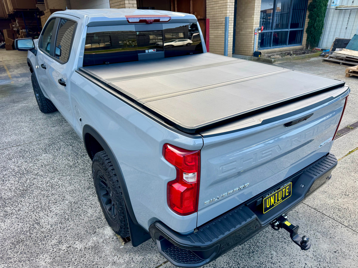 Silverado 1500 tri-fold lid — panel open showing tub access