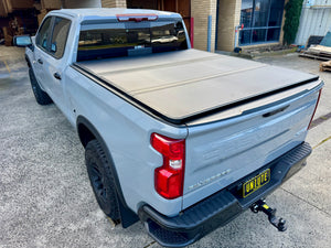 Silverado 1500 tri-fold lid — panel open showing tub access