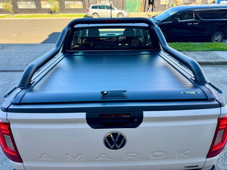Extended sports bar on ute — close-up of the matte black roll bar and mounting feet