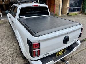 GWM Cannon Alpha 2024+ roller shutter — three-quarter rear view installed