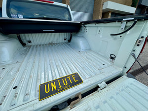 Nissan Navara NP300 roller shutter — control switch and tailgate weather-seal detail