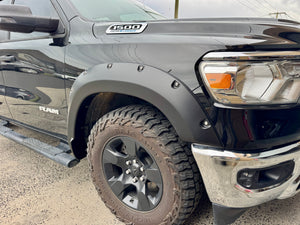 RAM 1500 DT 2019-2026 textured fender flares — three-quarter front view