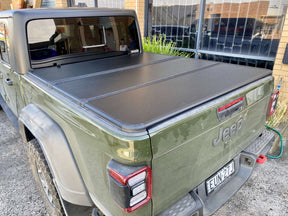 Tri-fold hard lid tonneau cover for Jeep Gladiator 2020-2026 — closed installed view | UniUte