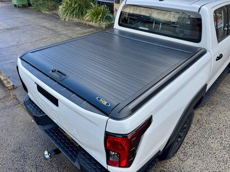 Toyota Hilux N90 2026+ roller shutter — fully closed protecting truck bed cargo