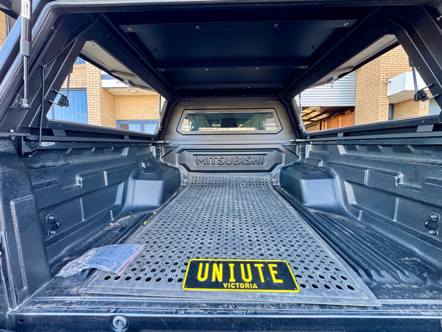 Triton MV stainless steel canopy — rear view with the door closed