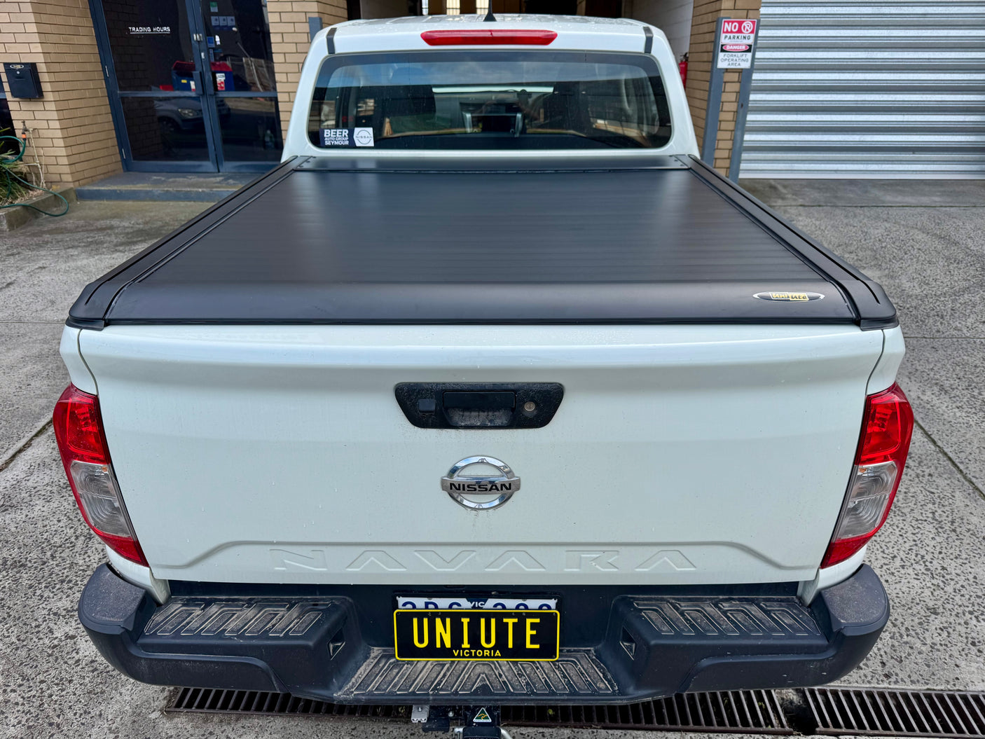 Nissan Navara NP300 electric roller shutter — fully retracted showing complete tub access