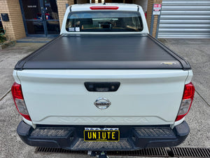 Nissan Navara NP300 electric roller shutter — fully retracted showing complete tub access