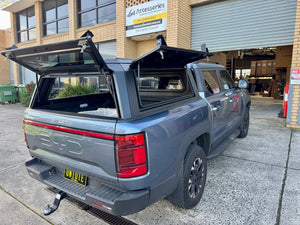 BYD Shark 6 steel canopy — tinted side window detail showing seal and frame