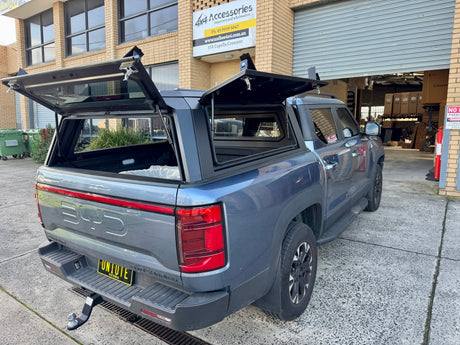 BYD Shark 6 steel canopy — tinted side window detail showing seal and frame