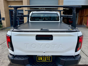UniUte aluminium ladder rack — ladder loaded showing secure transport configuration