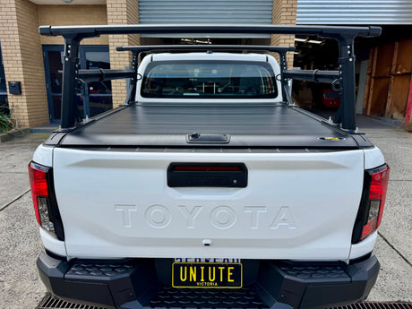 UniUte aluminium ladder rack — ladder loaded showing secure transport configuration
