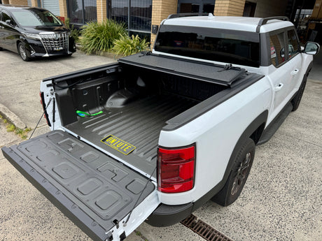 BYD Shark 6 Tub Cover installed on 2025 model, showcasing quad-fold hard lid tonneau cover for enhanced utility and style.