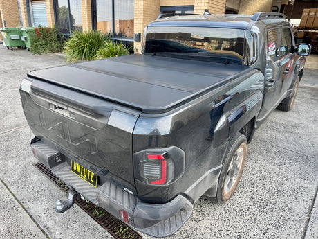 KIA Tasman tri-fold hard lid 2025+ — installed closed view | UniUte