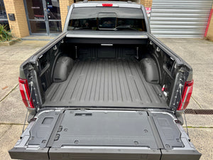 Ford F-150 roller shutter — control switch and tailgate weather-seal detail