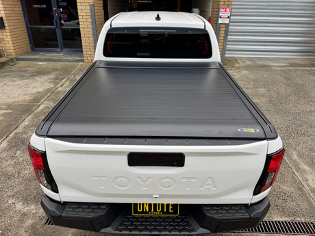 Hilux N80 N90 2015–2026 electric roller shutter — rolled back into the canister at the bulkhead
