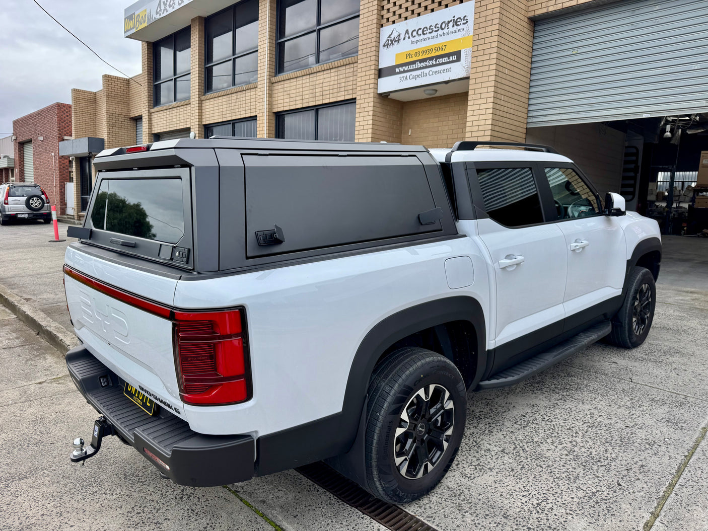BYD Shark 6 2025+ stainless steel canopy — installed on ute, front view with gullwing doors closed | UniUte