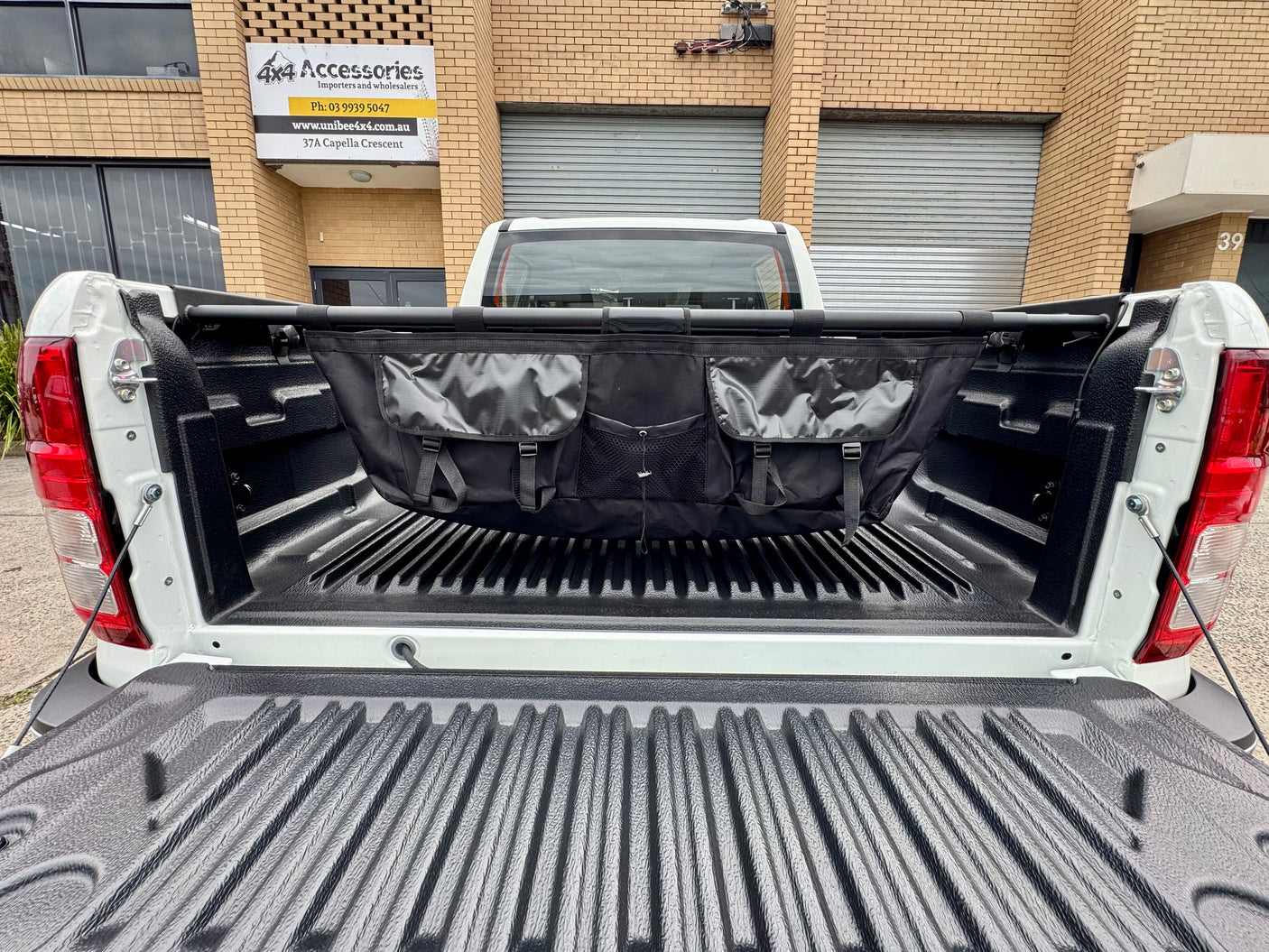 Universal ute tray hammock — side view showing suspension and clearance