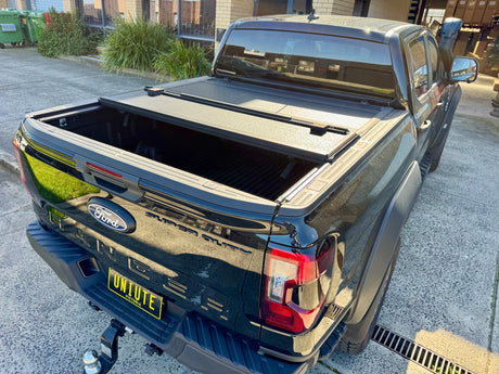 UniUte quad-fold hard lid for Ford Ranger NextGen — rubber seal and hinge detail