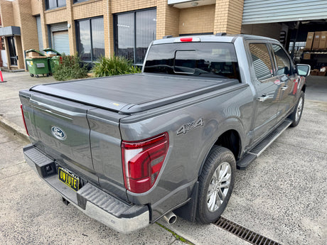 Ford F-150 2015–2026 electric roller shutter — fully retracted showing complete bed access