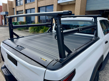 Heavy duty aluminium ladder rack for roller covers — installed on ute showing full rack height | UniUte