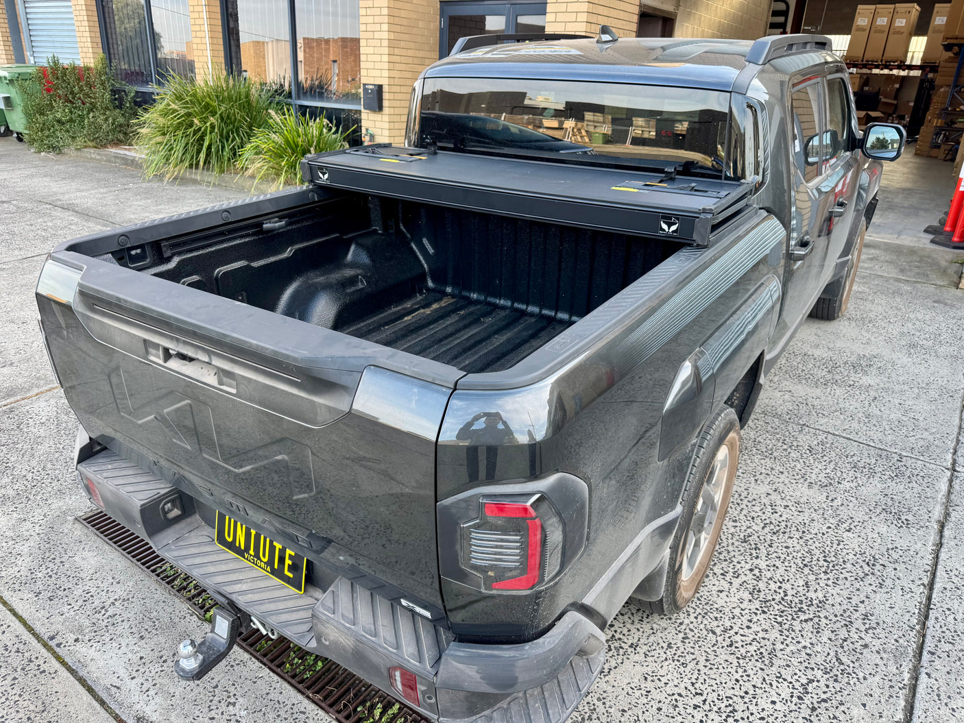 KIA Tasman 2025+ tri-fold hard lid — all panels folded toward cab