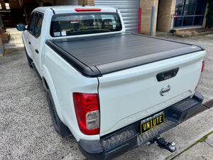 Navara NP300 2015–2025 electric roller shutter — rolled back into the canister at the bulkhead