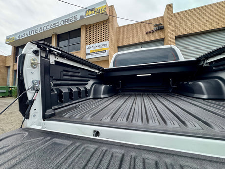 Electric roller shutter for Hilux N80 N90 — half-open position showing motorised operation