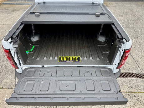 BYD Shark 6 tub cover showcasing quad-fold hard lid for 2025+ models, open to reveal spacious truck bed.