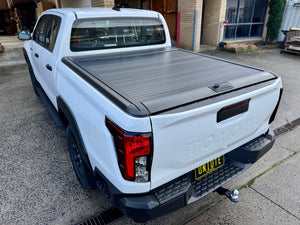 Hilux N90 roller shutter — side profile showing low-profile slat design on 2026+ model
