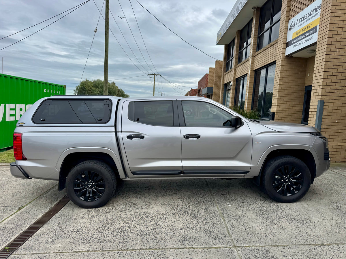 Mitsubishi Triton MV canopy — rear door open showing interior tub storage
