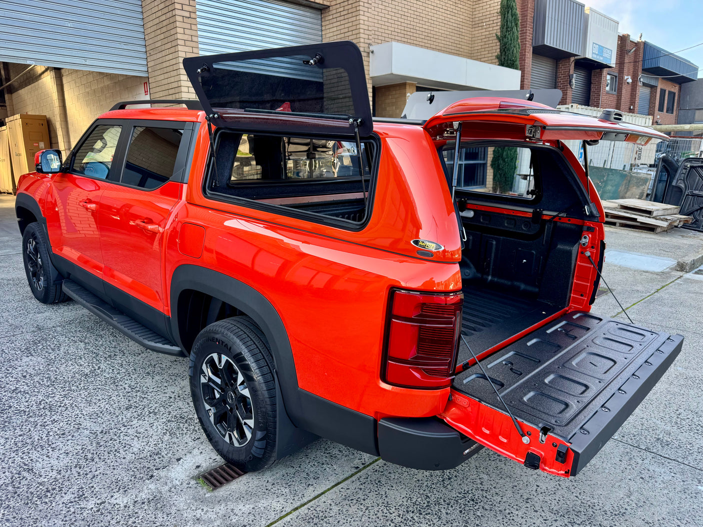 BYD Shark 6 fibreglass canopy — rear door open showing interior tub storage