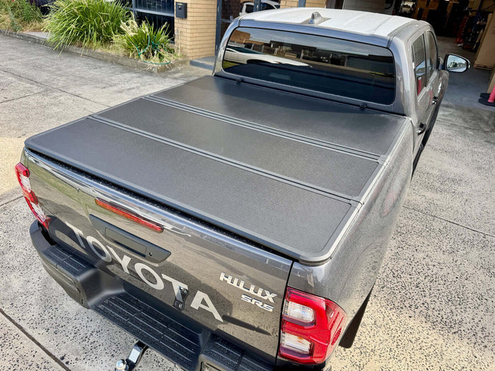 Tri-fold hard lid for Toyota Hilux N80 N90 2015-2026 — installed SR5 closed | UniUte