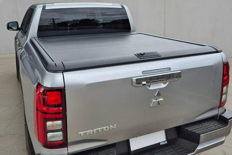Mitsubishi Triton Roller Shutter MV 2024+ Gen2 Manual on a black truck, enhancing cargo security and style.