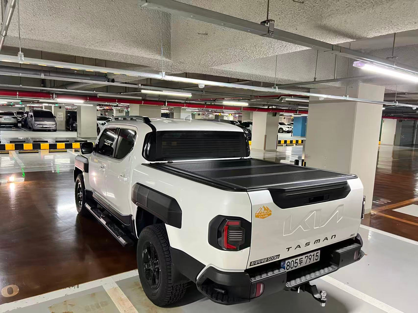 KIA Tasman 2025+ quad-fold hard lid — installed closed view showing flush fit