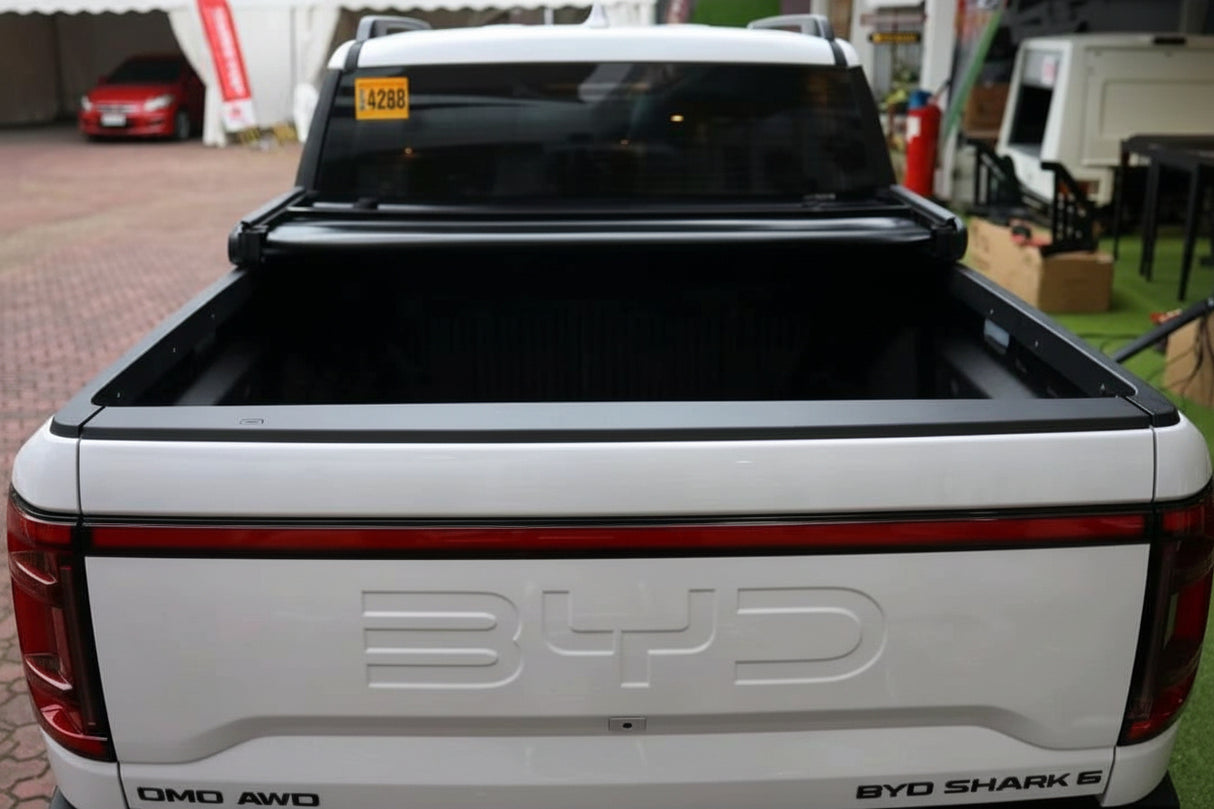 BYD Shark 6 Tonneau Cover for 2025+ showcasing open truck bed, perfect for weather protection.