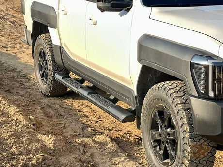 KIA Tasman side steps 2025+ black side bars on rugged off-road vehicle showcasing durable design and enhanced protection